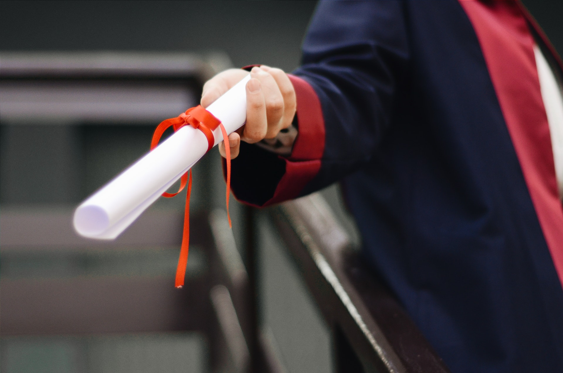 Student holding graduation paper